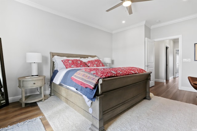 bedroom with hardwood / wood-style flooring, ceiling fan, and ornamental molding