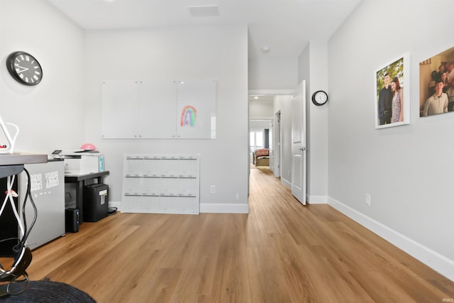 office space with light wood-type flooring