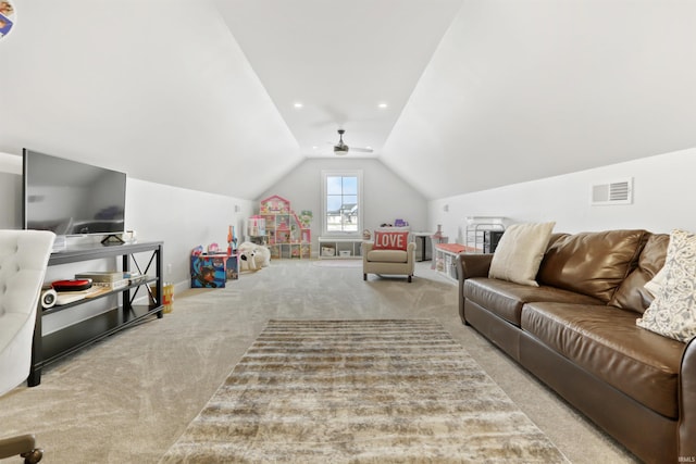 carpeted living room with lofted ceiling