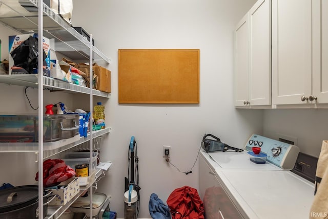 laundry area with cabinets and washer and dryer