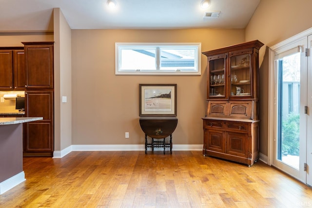 unfurnished room featuring light hardwood / wood-style flooring