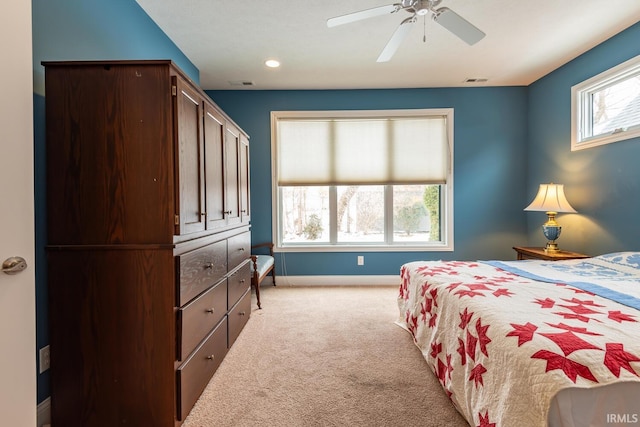 bedroom featuring ceiling fan and light colored carpet