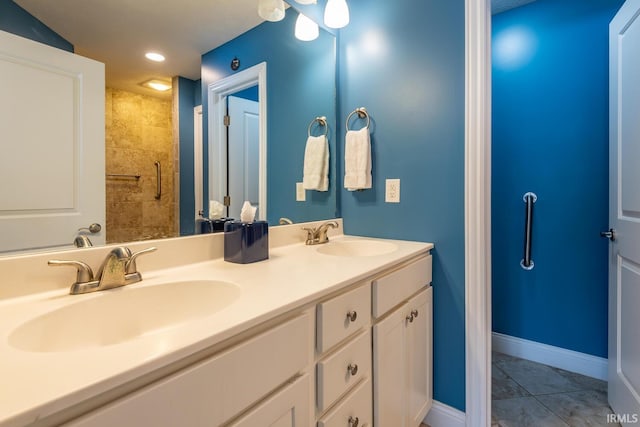 bathroom featuring tile patterned flooring and vanity