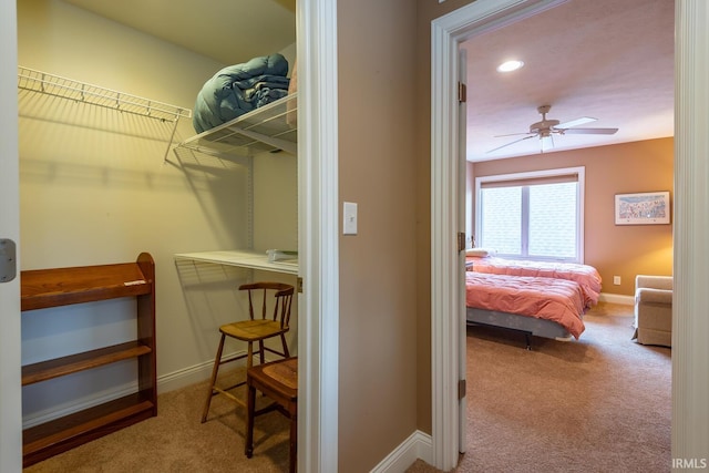 interior space featuring carpet floors and ceiling fan