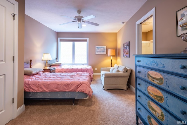 bedroom with ceiling fan and light colored carpet