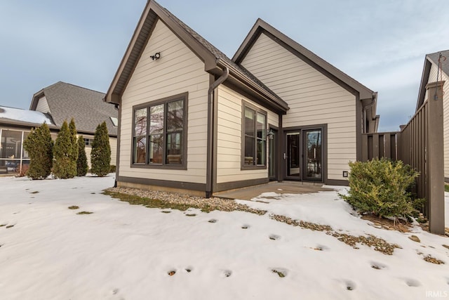 view of snow covered house