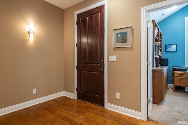 foyer entrance featuring wood-type flooring