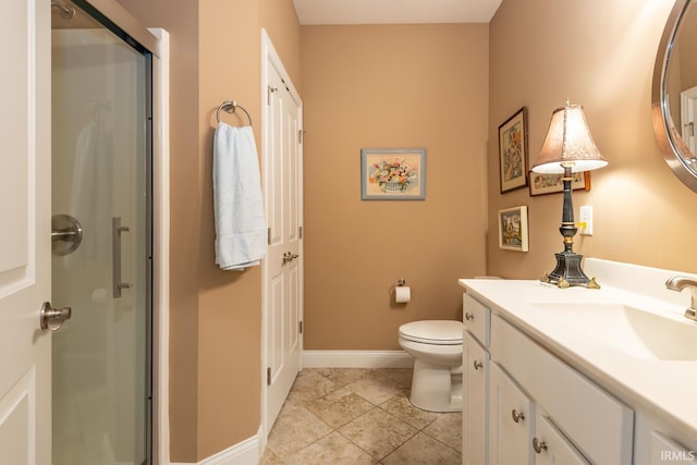 bathroom with toilet, tile patterned flooring, walk in shower, and vanity