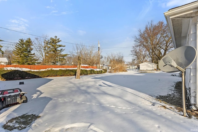 view of yard layered in snow