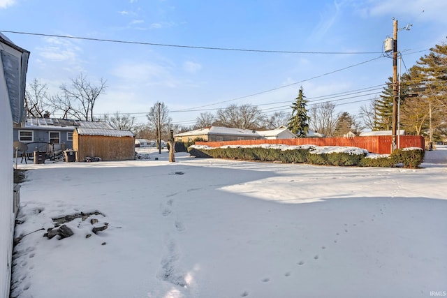 view of yard covered in snow