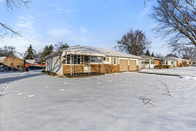 ranch-style home featuring a garage