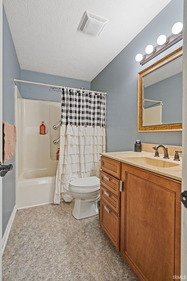 full bathroom with vanity, a textured ceiling, toilet, and shower / bath combo