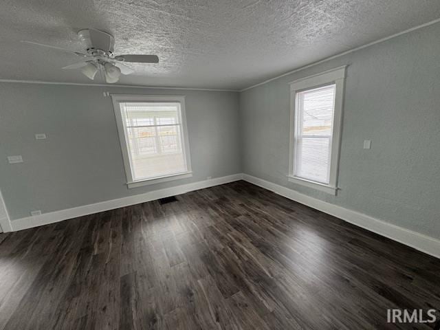 unfurnished room with dark wood-type flooring, ceiling fan, and ornamental molding