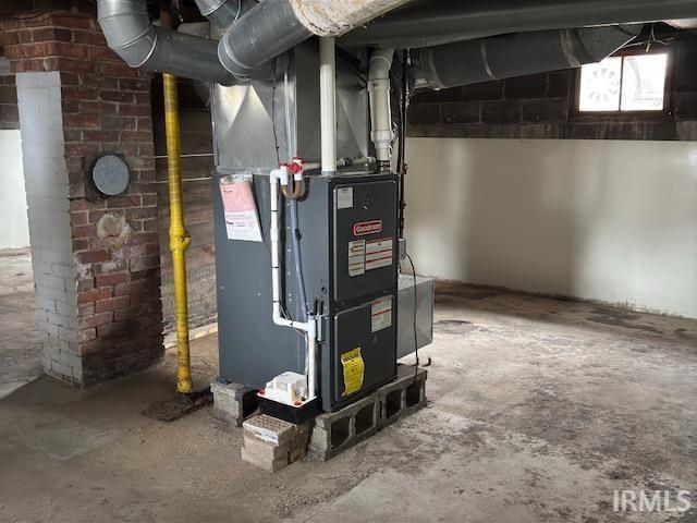 utility room with heating unit