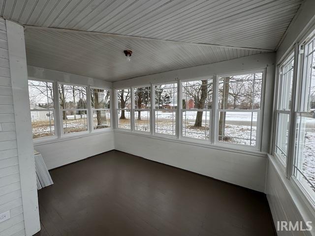 unfurnished sunroom with plenty of natural light