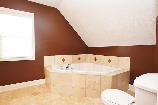 bathroom with vaulted ceiling, tile patterned flooring, a relaxing tiled tub, and toilet