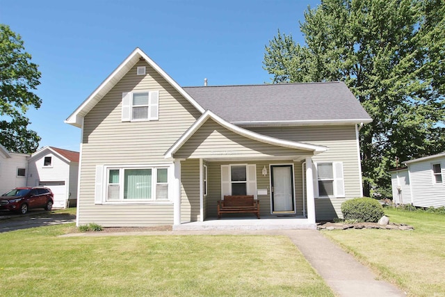 view of front of property featuring covered porch and a front yard