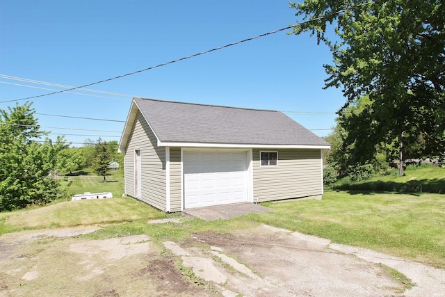 garage featuring a yard