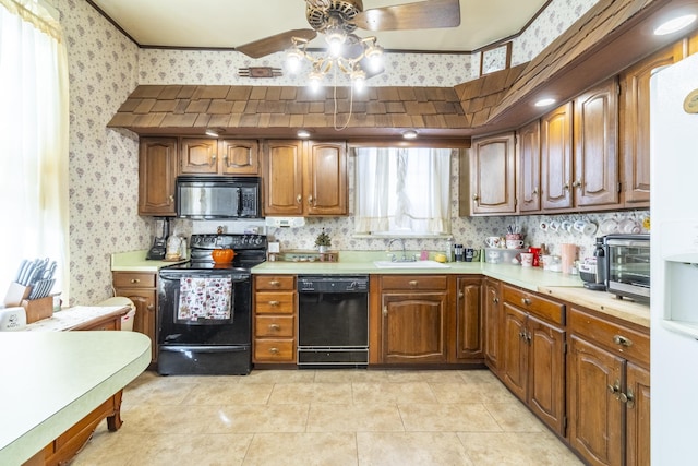 kitchen with black appliances, ceiling fan, light tile patterned flooring, and sink