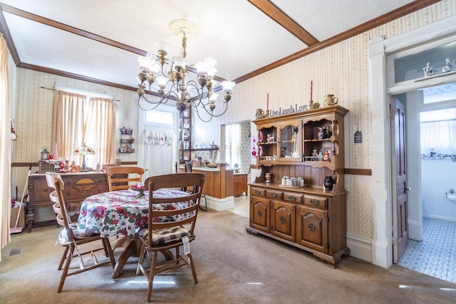 dining space with light carpet, a textured ceiling, a notable chandelier, and crown molding