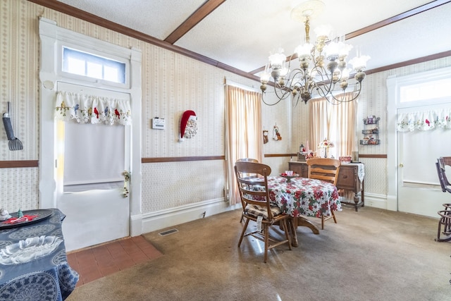 carpeted dining space with a chandelier and ornamental molding