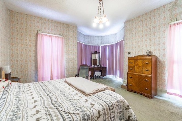 bedroom with carpet and an inviting chandelier