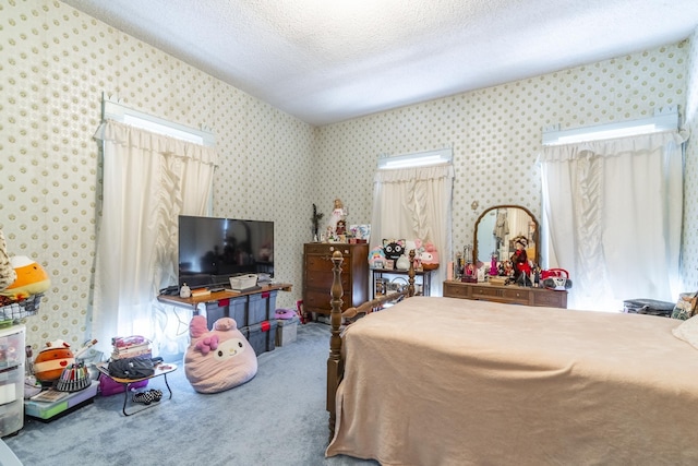 carpeted bedroom featuring a textured ceiling