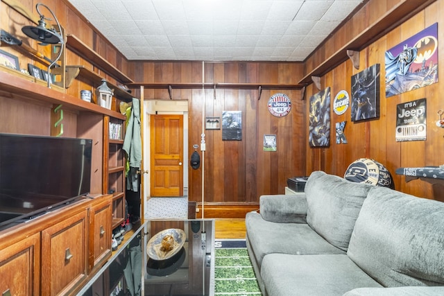 living room with wood walls and a wall mounted air conditioner