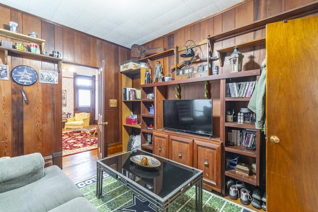 living room featuring wooden walls