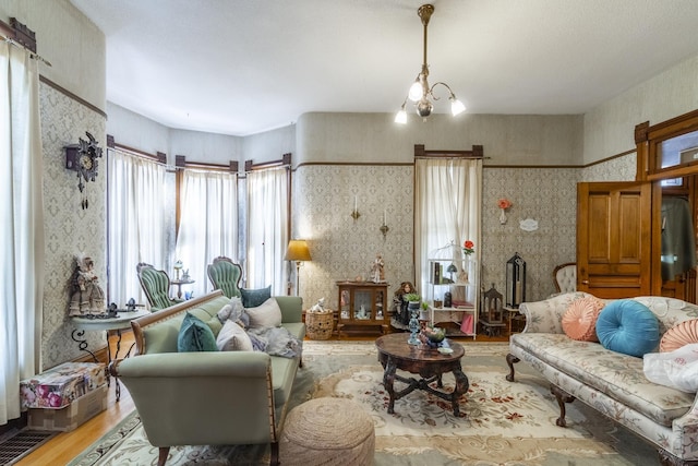 living room featuring hardwood / wood-style floors and a chandelier