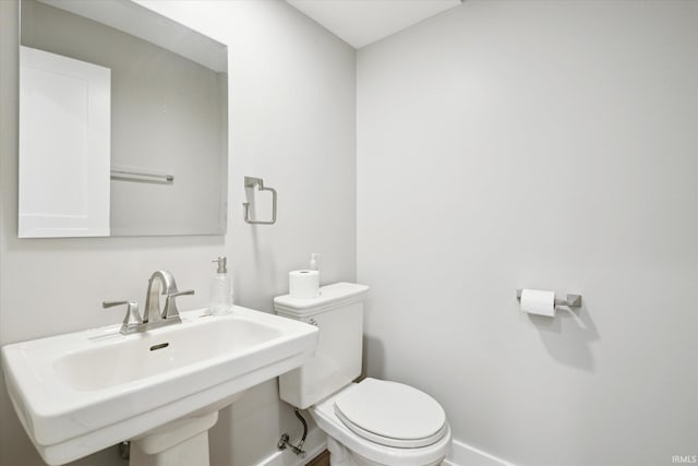 bathroom with sink and toilet