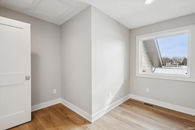 spare room featuring light wood-type flooring