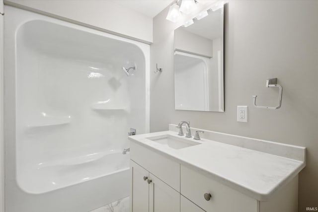 bathroom with vanity and a tub to relax in