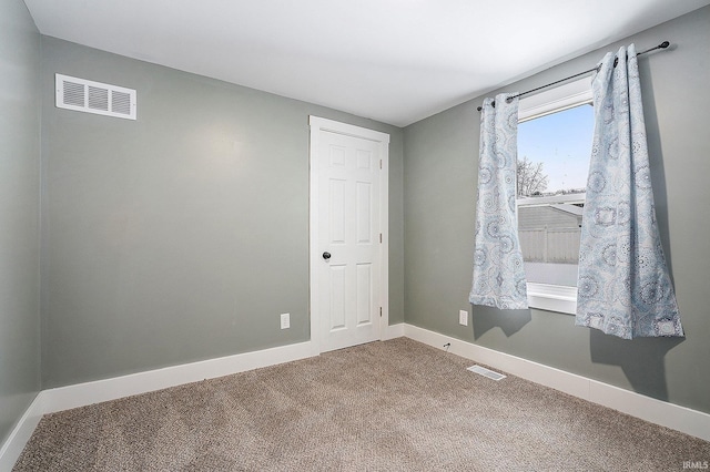 view of carpeted spare room