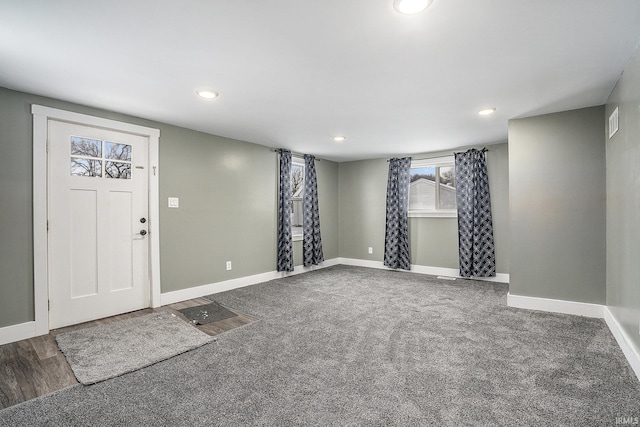 foyer with carpet flooring