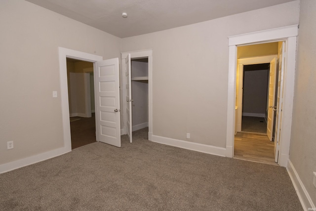 unfurnished bedroom with carpet and a closet