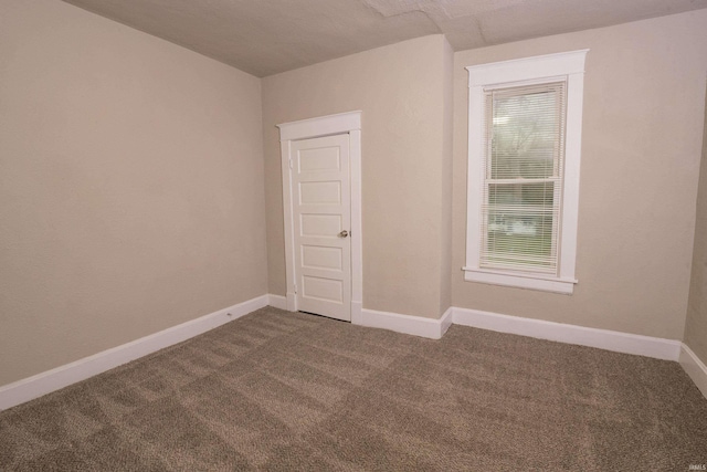 empty room with carpet flooring