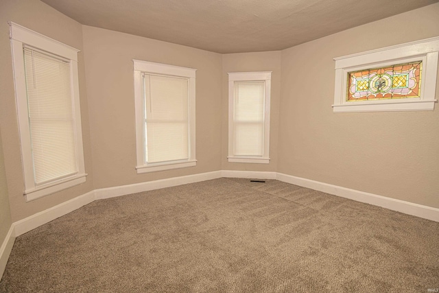 spare room with carpet flooring