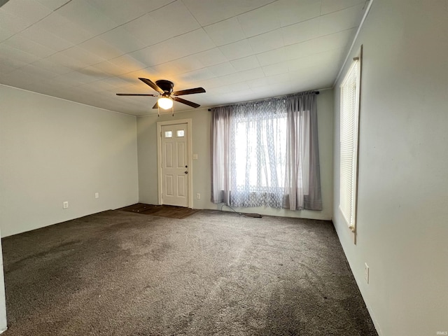 interior space with ceiling fan