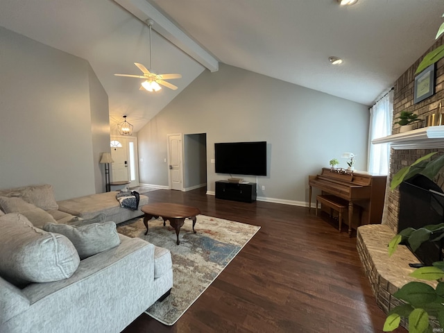 living room with ceiling fan, dark wood-type flooring, beam ceiling, a fireplace, and high vaulted ceiling