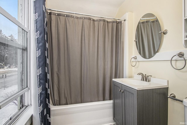 bathroom featuring vanity and shower / bath combo with shower curtain