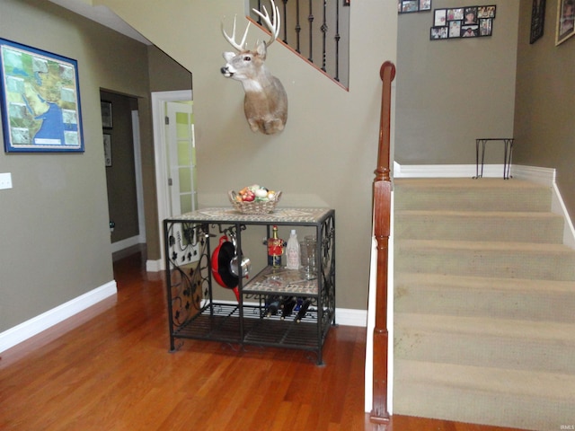 stairway featuring hardwood / wood-style flooring