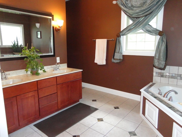 bathroom featuring a washtub, tile patterned floors, and vanity