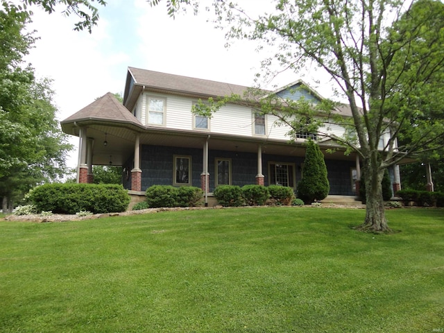 view of front of house with a front yard and a porch