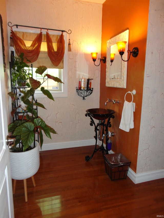 bathroom with hardwood / wood-style flooring