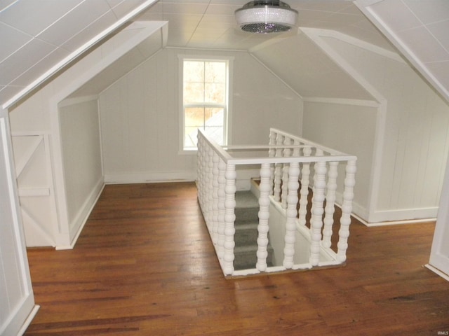 bonus room featuring dark hardwood / wood-style floors and vaulted ceiling