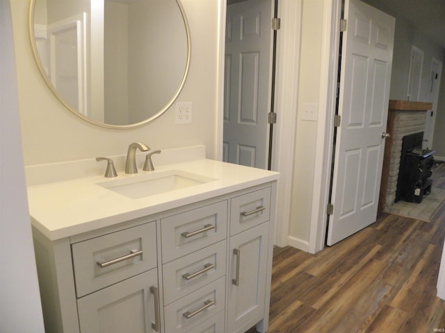 bathroom with hardwood / wood-style flooring and vanity