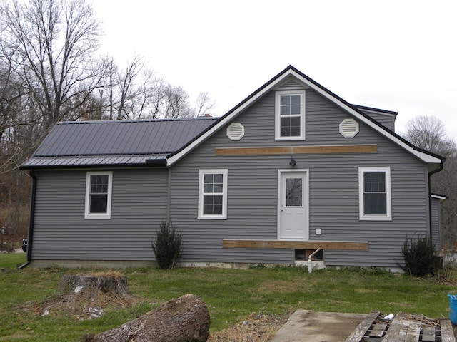 back of property with a lawn