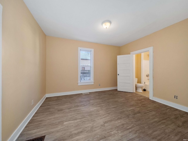 spare room featuring hardwood / wood-style floors