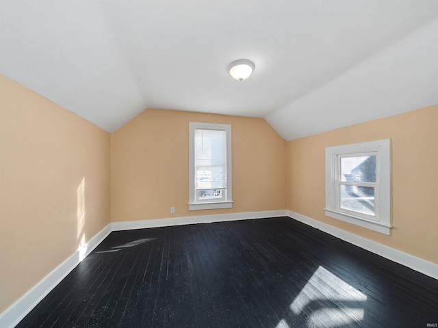 bonus room featuring hardwood / wood-style flooring and lofted ceiling